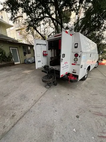 Magnet Plumbing service vehicle on-site for Water Heater Repair in Holiday